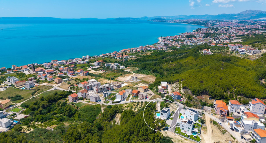The peaceful elevated location offers privacy, natural surroundings, and easy access to the coast