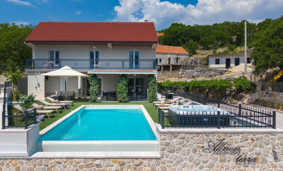 Set on a fenced 950-square-meter private plot, Villa Adrion Terra boasts a variety of outdoor amenities designed for relaxation and entertainment.