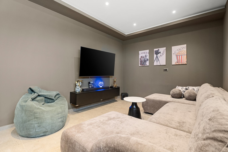 A well-equipped game room with a PS5 for children's entertainment.
