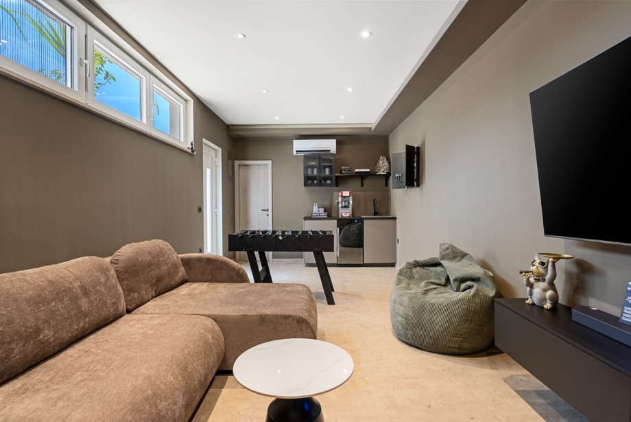 The well-equipped game room also includes table football, darts and a small kitchenette.