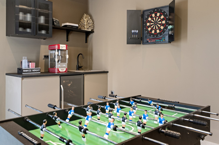 The well-equipped game room also includes table football, darts and a small kitchenette.