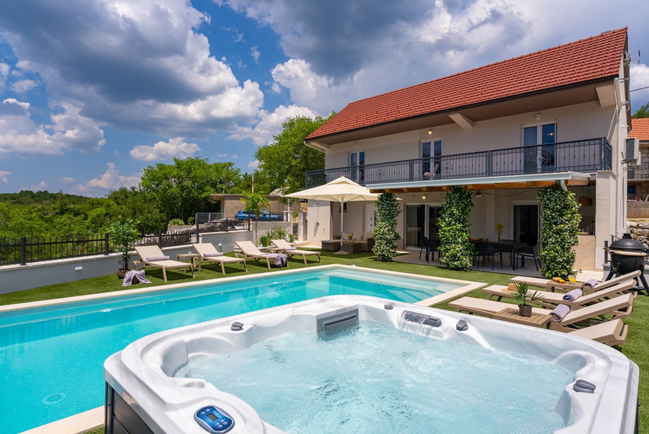 Set on a fenced 950-square-meter private plot, Villa Adrion Terra boasts a variety of outdoor amenities designed for relaxation and entertainment.