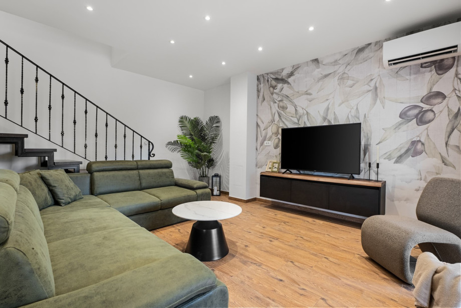 Spacious air-conditioned living room for comfortable evening gatherings