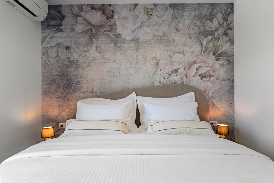 Modernly decorated, air-conditioned bedroom with a beautiful king-size bed
