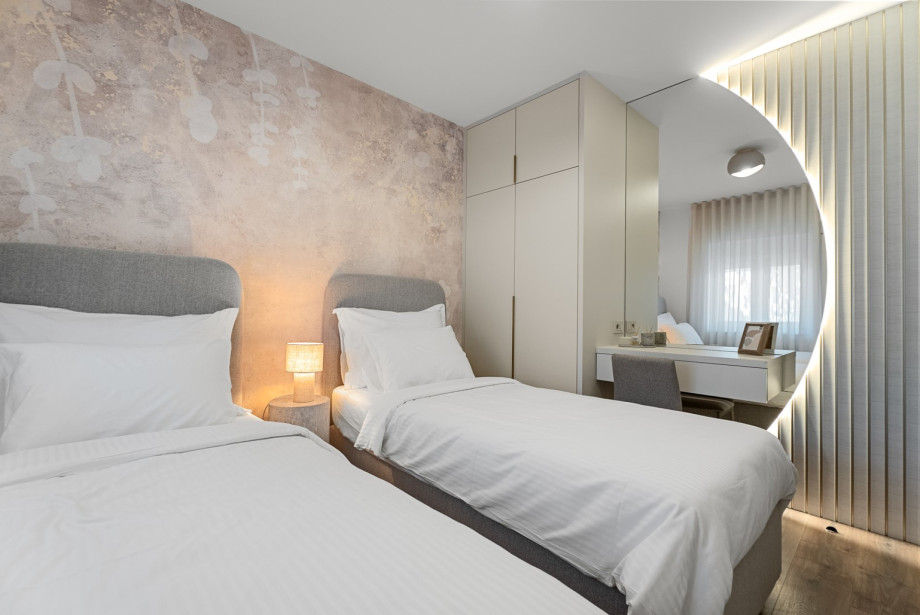 Modernly decorated, air-conditioned bedroom with a family bathroom next to the room