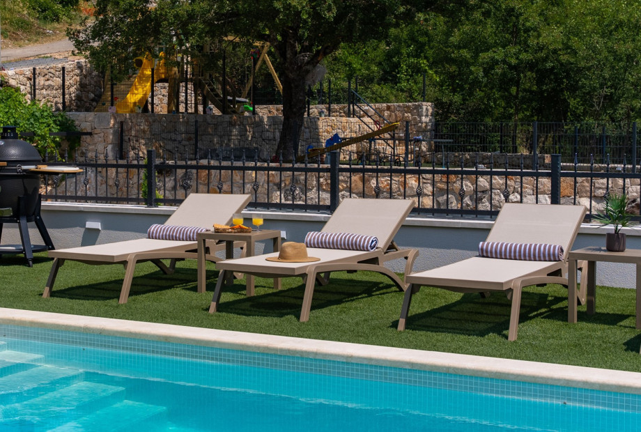 An outdoor shower adds convenience after swimming or outdoor activities.