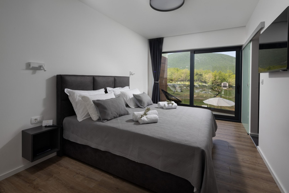Bedroom No2 with a king-size bed 180cm x 200cm, A/C, TV, en-suite bathroom with a shower