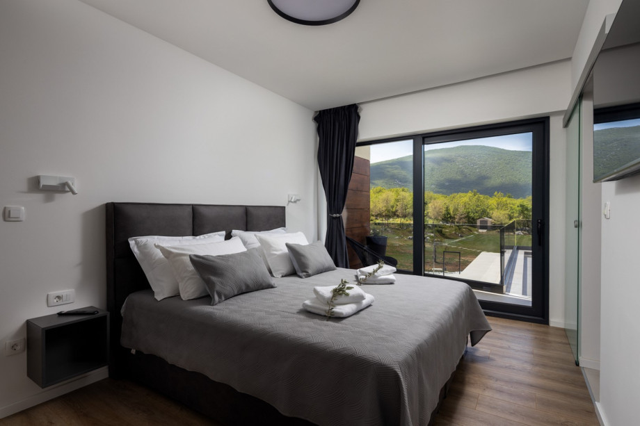 Bedroom No4 with a king-size bed 180cm x 200cm, A/C, TV, en-suite bathroom with a shower, a balcony