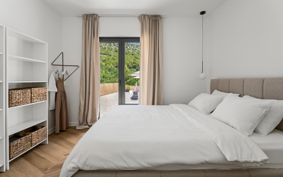 Bedroom No1 also offers air-conditioning, and French doors leading to the pool area