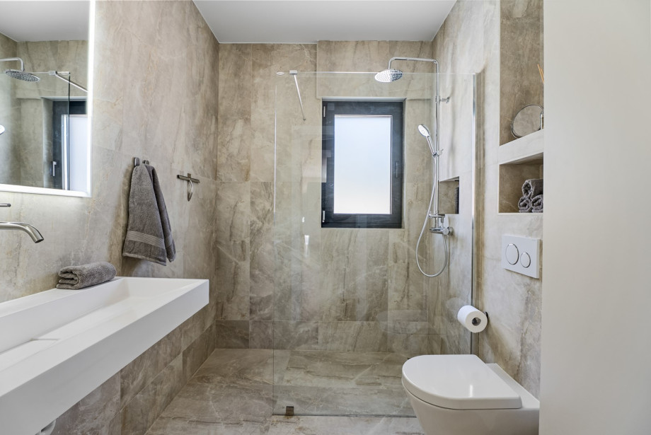 The first family bathroom (5 sqm) is equipped with a shower, sink, and toilet