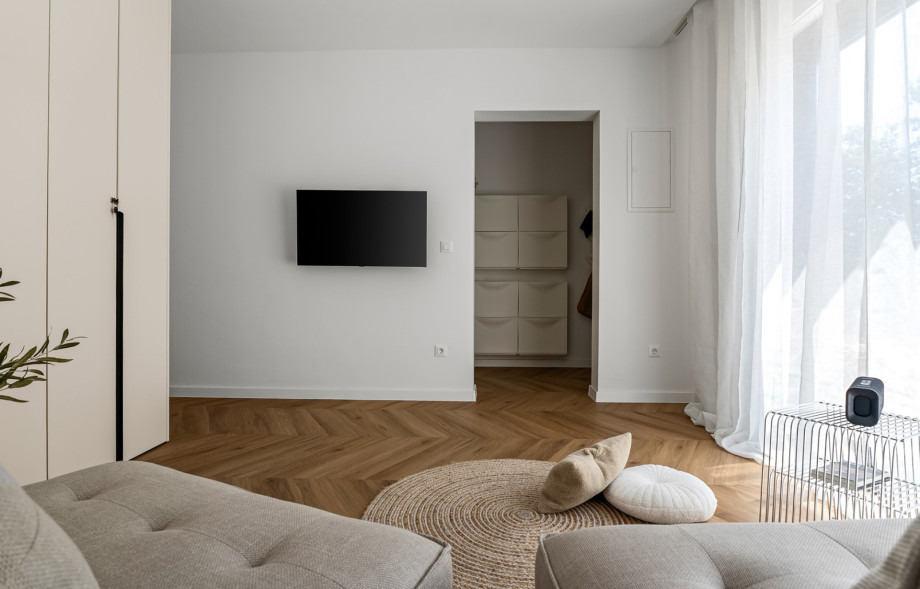 The second living room features air conditioning, a flat-screen TV, two sofas, and some family games