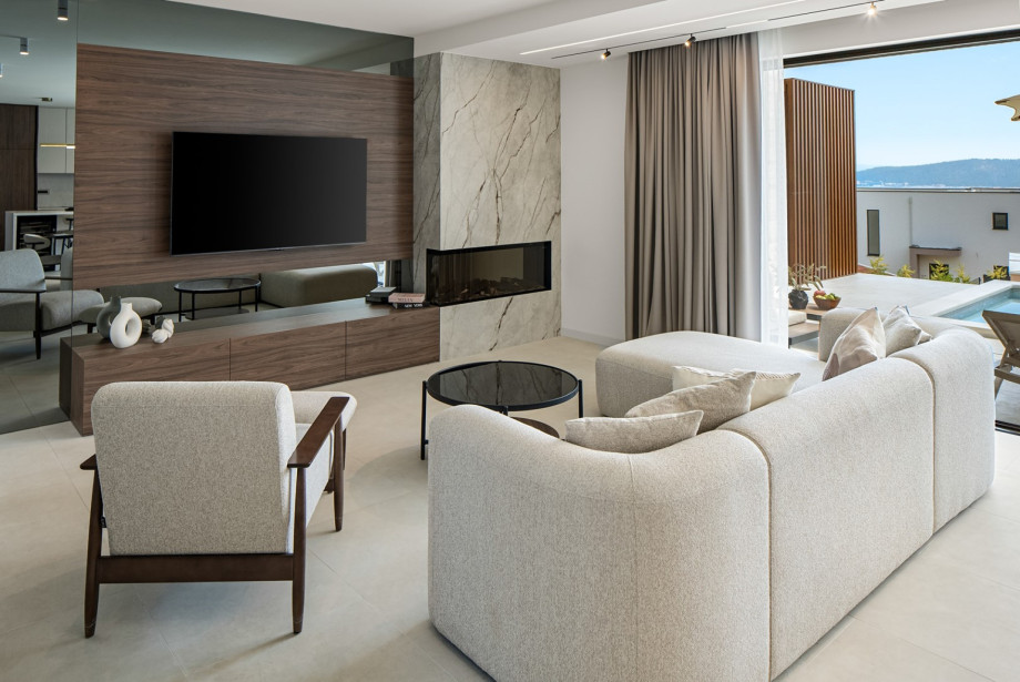 A bright and comfortable living room with a cozy seating area, designed for relaxation and quality time together
