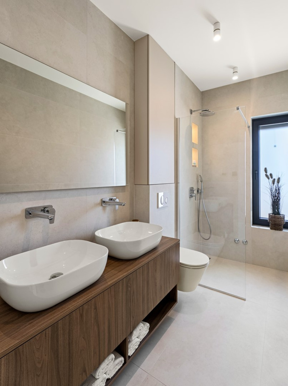 Bedrooms No2 and No3 share a family bathroom with a shower, double sink and a toilet
