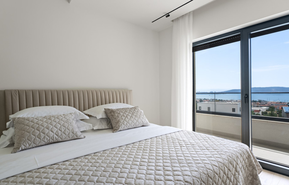 Bedroom No4 also offers TV, A/C, and exit to a balcony with sea views and views of town Split