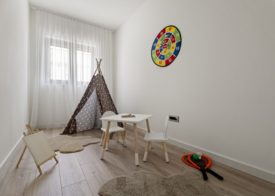 A cheerful playroom with some toys, creating a fun and safe environment for your youngest family members