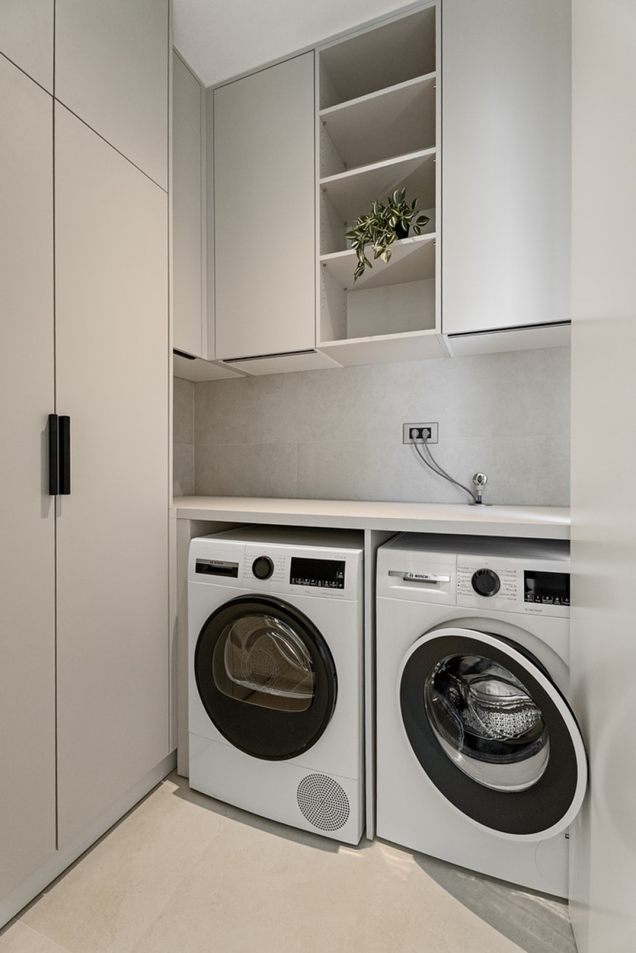 There is also a laundry with a washing machine, a dryer and ironing amenities
