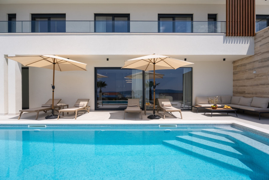Unwind by the stunning private pool and soak up the sun on the spacious sundeck, the perfect setting for relaxation, refreshing swims, and unforgettable moments