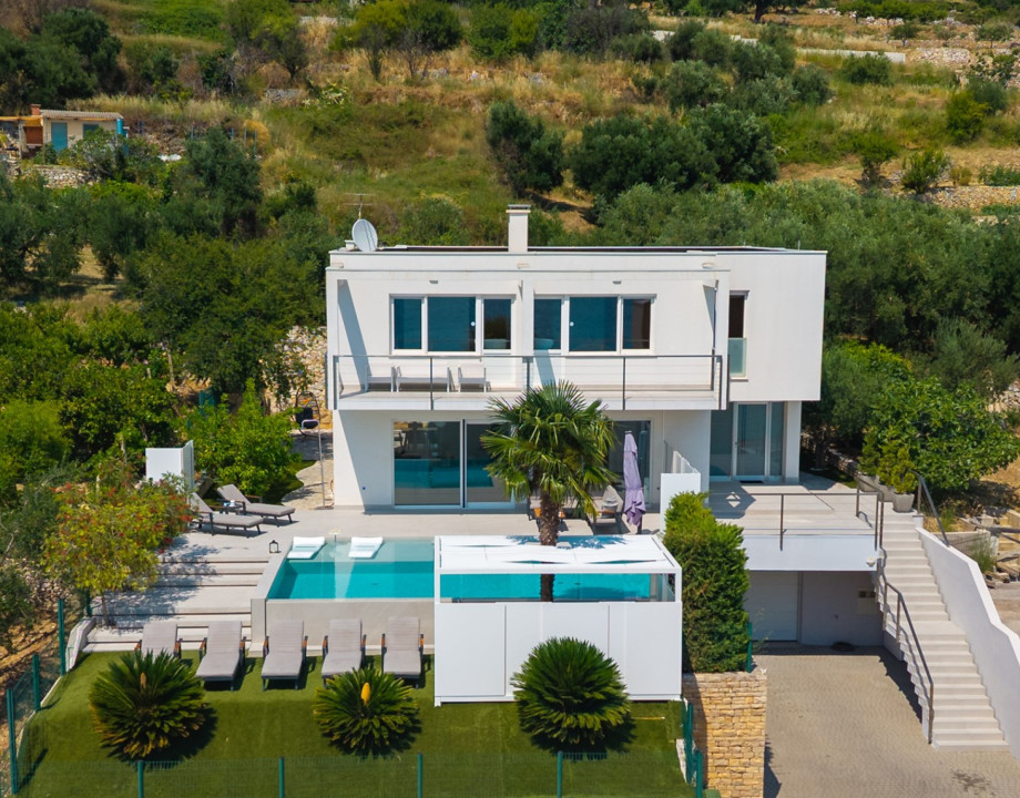 Nestled in the charming coastal village of Podstrana, just minutes from the historic city of Split