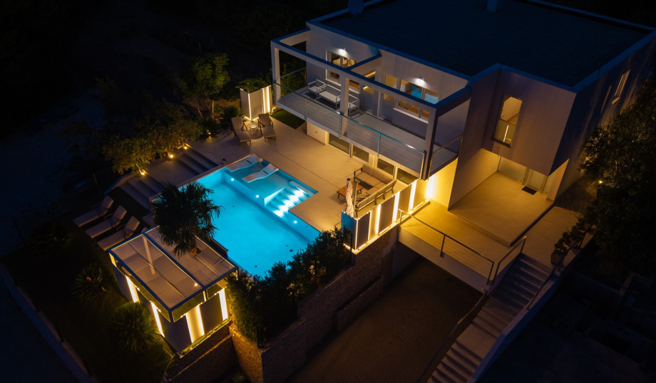 A beautifully landscaped garden, a spacious terrace, and a dedicated outdoor dining area