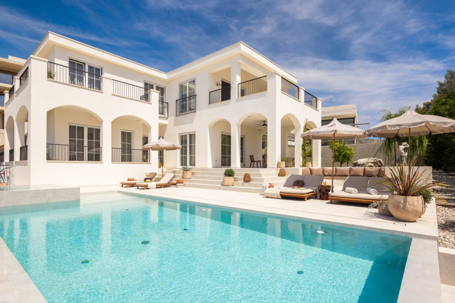This stunning 400-square-meter residence, set on a fully fenced 1,000-square-meter lot