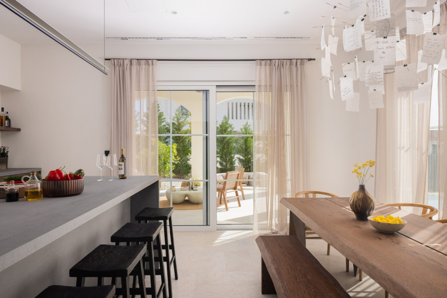 Kitchen include a microwave, Nespresso and Sage coffee machines, toaster, kettle, and a generous kitchen island with bar stools for casual dining