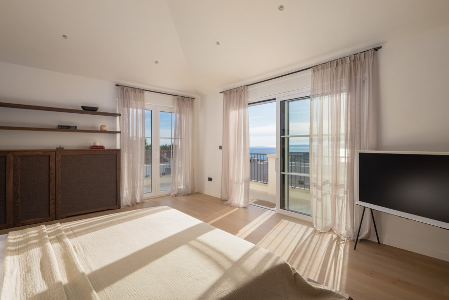 Bedroom No1 offers a private balcony with panoramic sea and neighborhood views