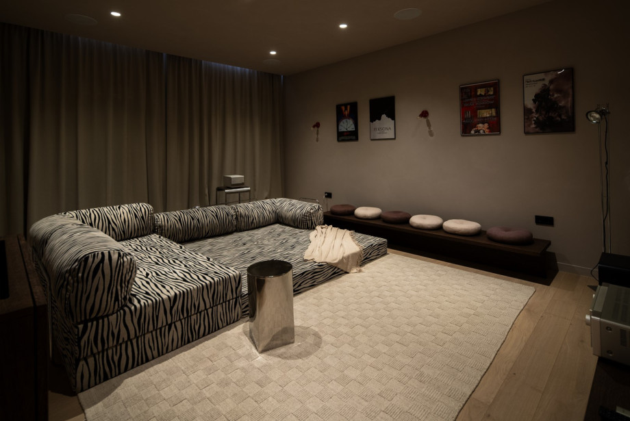 The dedicated cinema room is the perfect retreat for movie nights, featuring a high-quality projector