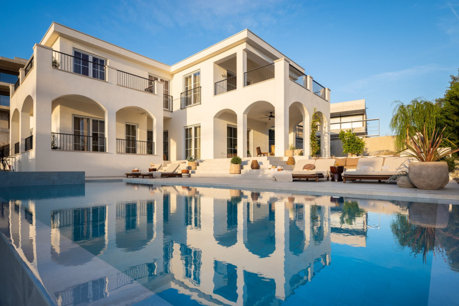 Unfolds across multiple levels and is a flawless example of contemporary Mediterranean elegance