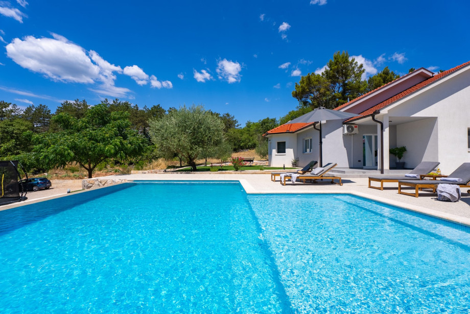 The outdoor oasis features an outdoor shower and sun deck.