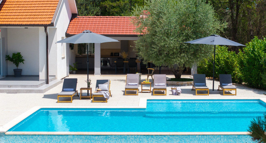 Relax on the sun deck right next to the infinity pool.