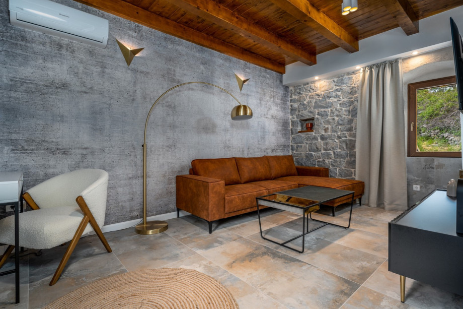 Villa Perina offers a stylish living room with A/C, TV and sofa
