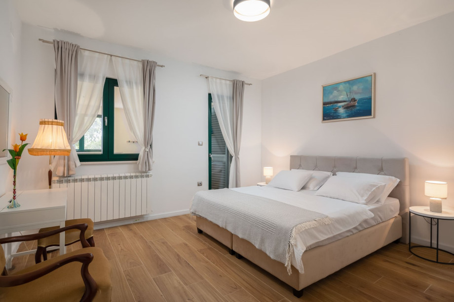 Bedroom NO1 with a king size bed 180cm x 200cm, A/C and door toward the terrace with the billiards