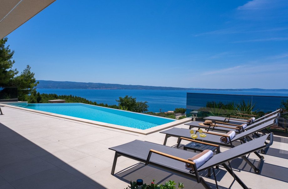 Heated infinity pool overlooking the coast.