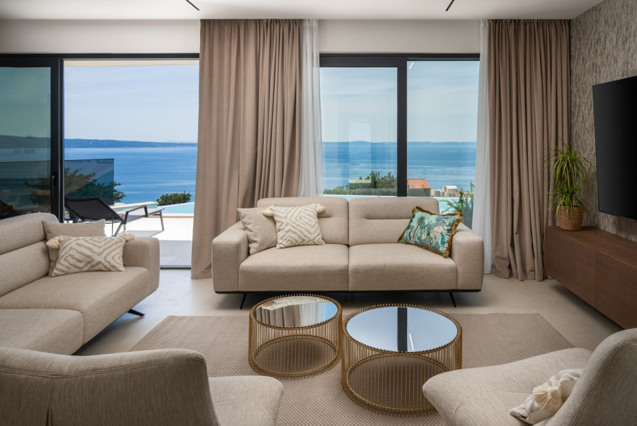 The living room with direct walk-out access to the pool deck.