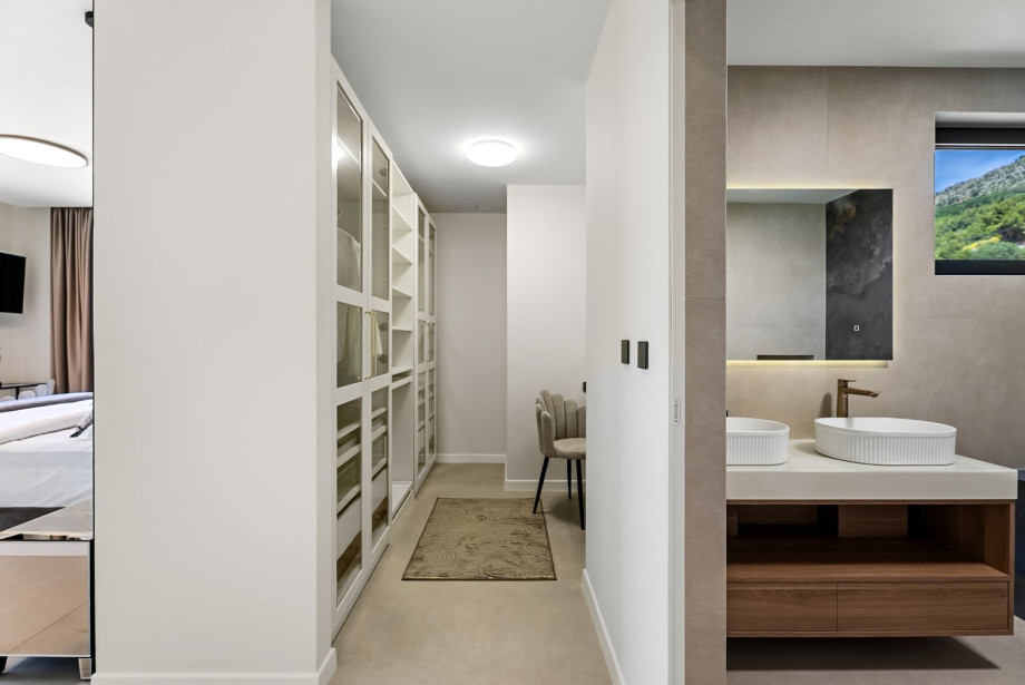 Spacious bedroom suite including a walk-in wardrobe.