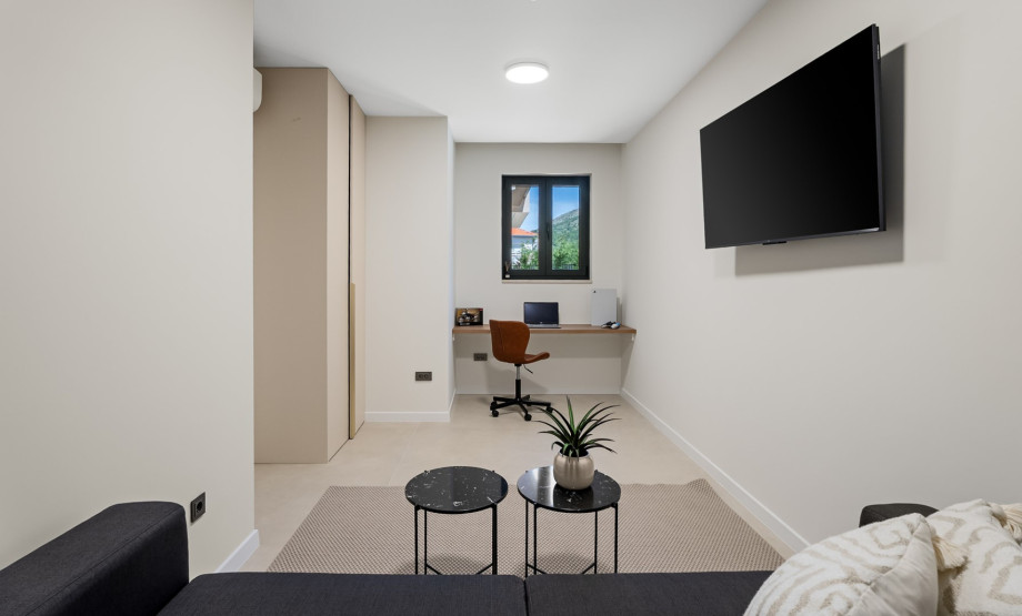 Additional room with a sofa that converts into a bed, a TV, and a PlayStation 5.