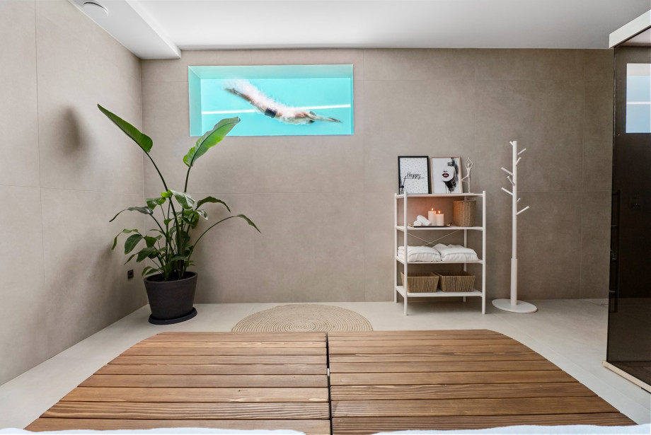 Relax on the two deck chairs inside the private Finnish sauna room.