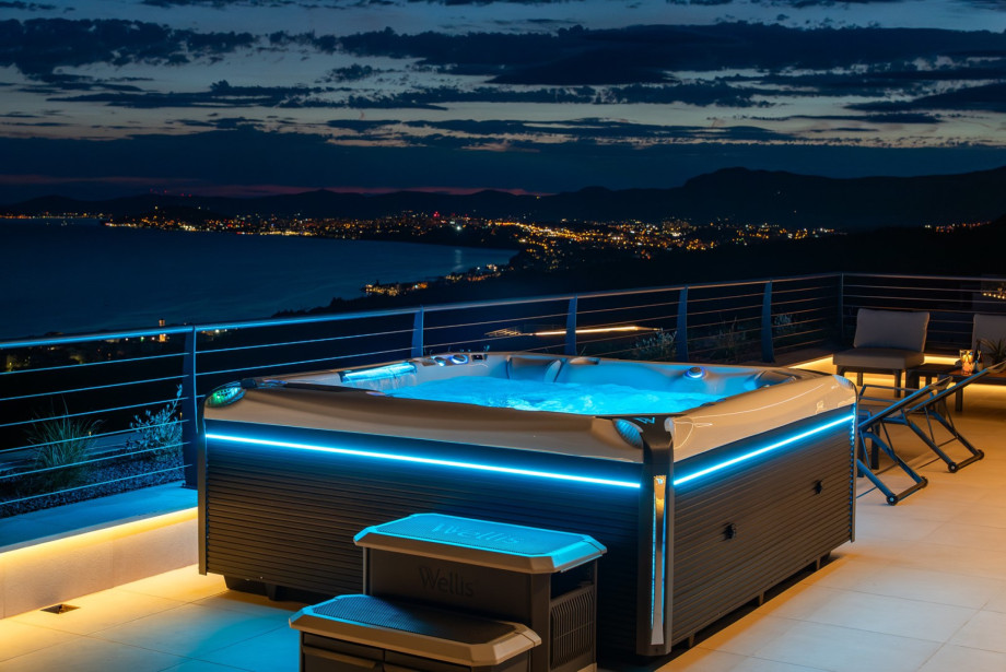 Rooftop whirlpool tub offering unobstructed panoramic views the sea.