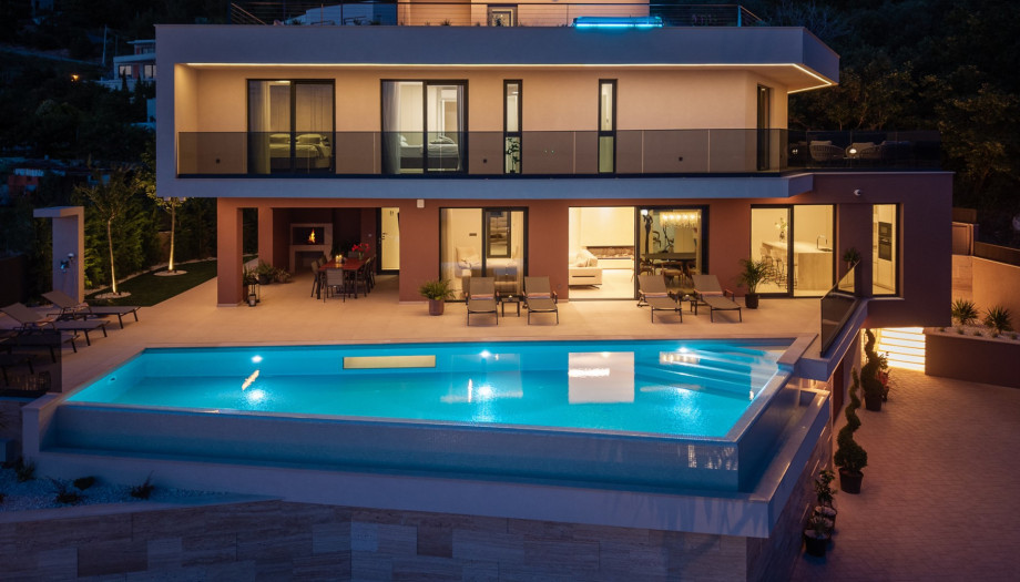 Access the pool area directly through the glass doors of the main living space.