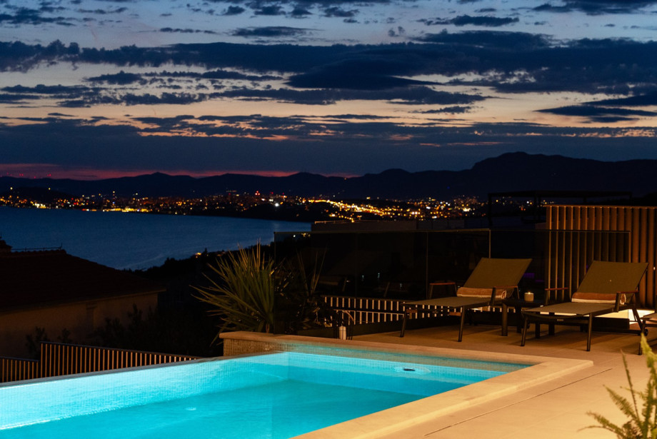 Modern infinity pool setup offering a direct view of the beautiful coast.