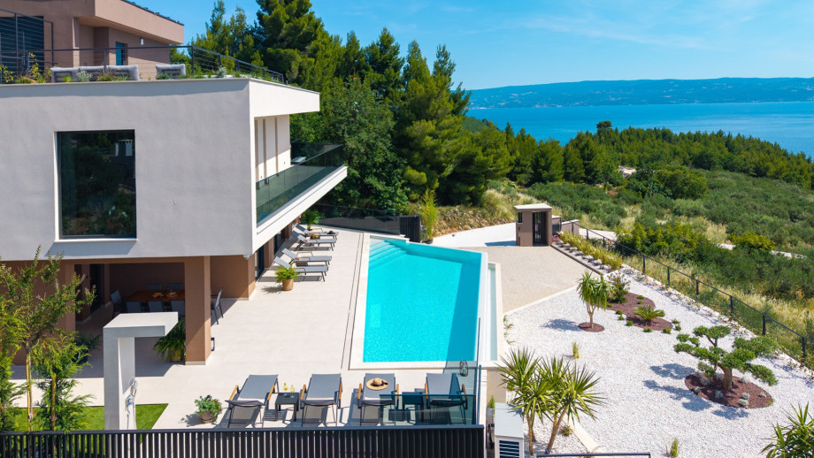 The villa features a luxurious 4 en-suite bedroom layout with breathtaking panoramic sea views.