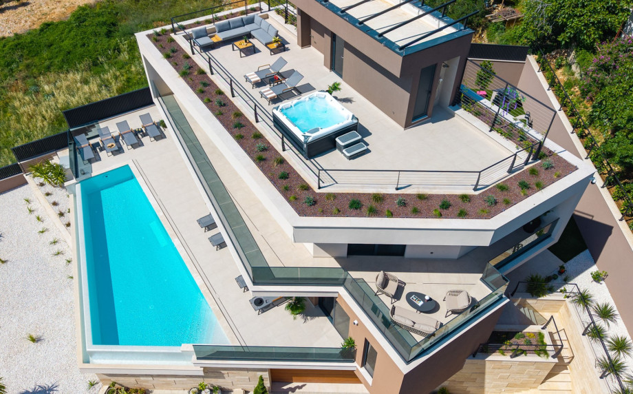 Secured private parking area with space for up to four cars and two garage spaces.