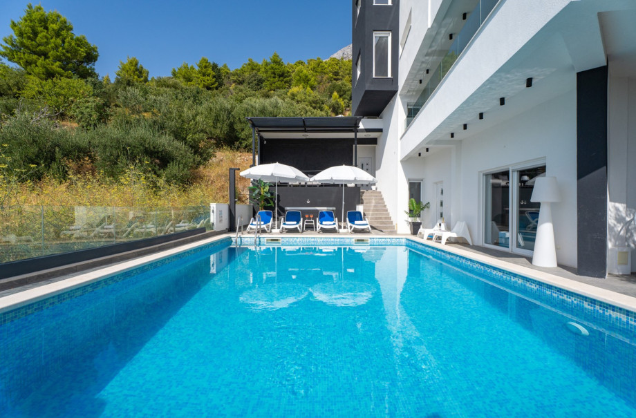 The outdoor area offers a private heated 32 sqm swimming pool (6.8 x 4.7m) with fully automated salt electrolysis system (Chlorine - Free)