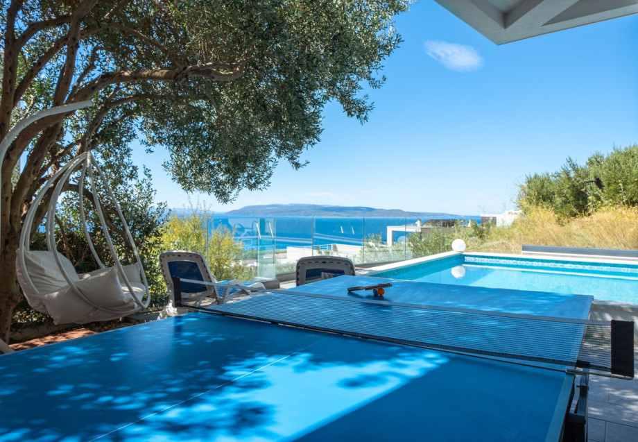 Enjoy a game of table tennis while taking in breathtaking views of the sea and pool.