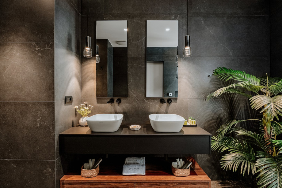 En-suite bathroom with a shower, and exit toward the pool area.