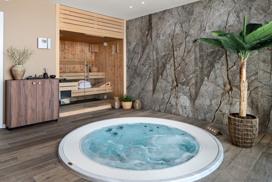 Light-filled spa and surrounded by floor-to-ceiling glass overlooking the sea.