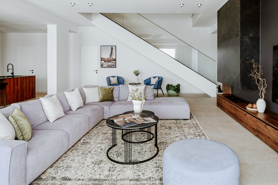 The spacious open-plan interior features a beautifully appointed L-shaped lounge