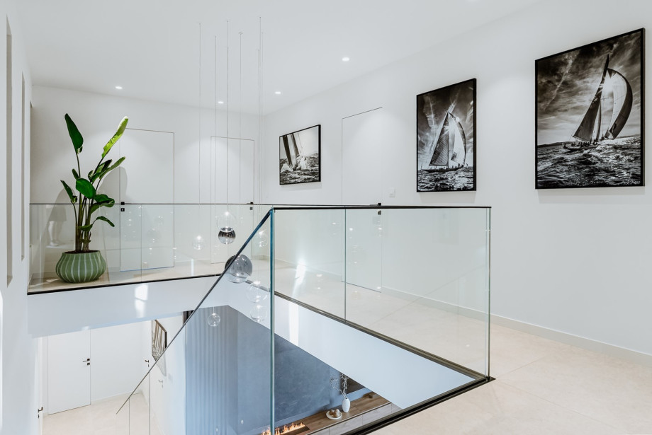 Villa Andoris offers an indoor staircase at the bedroom level on the first floor, downstairs to the living/pool area (ground floor level).