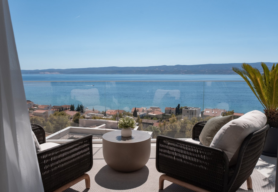 Relax, unwind, and take in the breathtaking sea view from the private balcony lounge at Villa Andoris