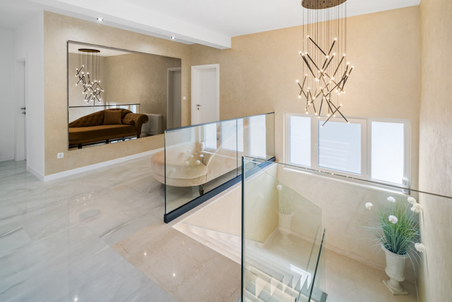 Spacious staircases and very nicely decorated hallways leading to the bedrooms